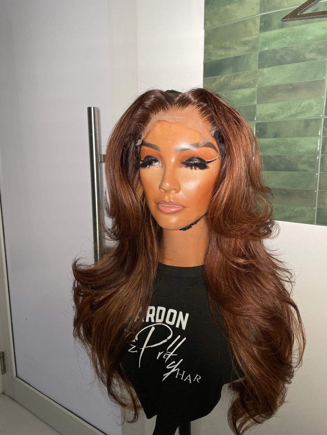 26” Honey w/ peek a boo blonde highlights and layers